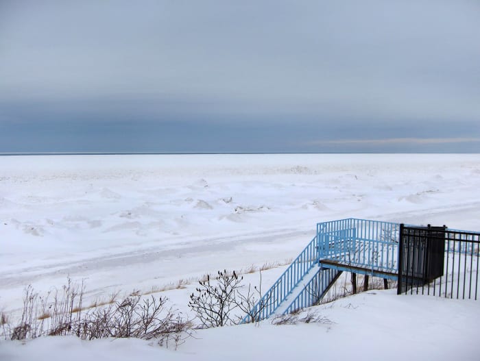 Bluff view of Lake Michigan ice sheet reaching the horizon one day after the 2014 POLAR VORTEX storm