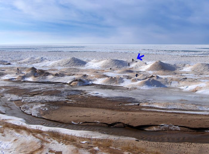 People taking risks at Pier Cove Beach, Southwest Michigan during a warm up one week after the Polar Vortex event of 2014