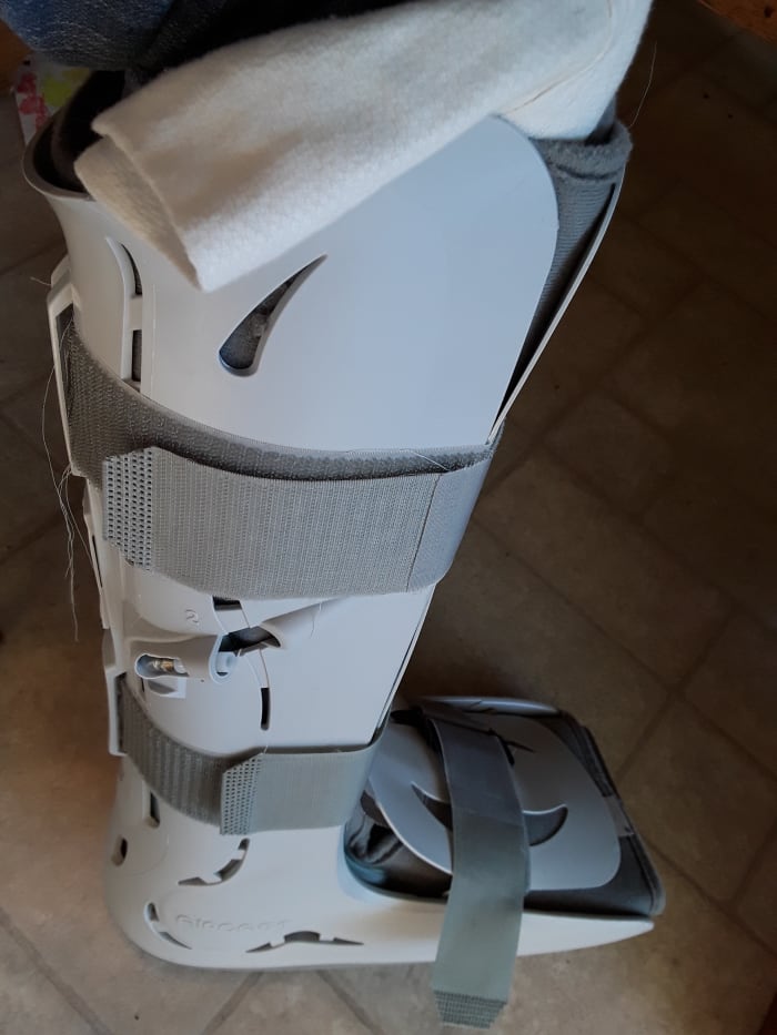 This walking boot was from an injury DH incurred last year. Inflatable bladders on the inside made it fit me snuggly as well. The physician's assistants encouraged me to keep using it.
