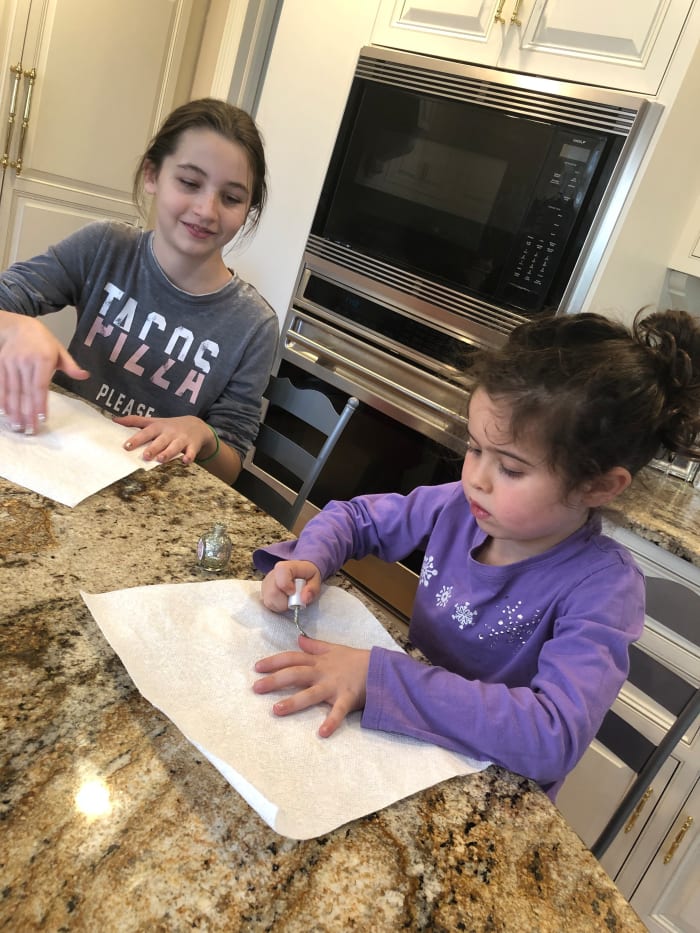 Here Em is painting her nails with her cousin at their Grandma's house. What better way to have fun with family than doing your nails together?