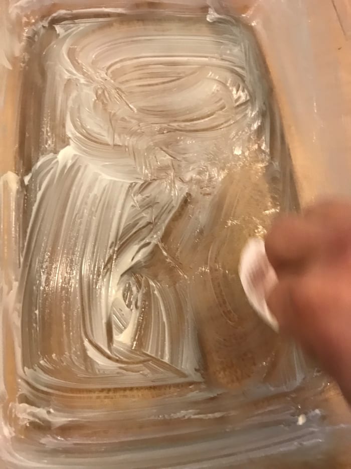 Butter a casserole dish. This is easiest by using a bit of the wrapper that the butter comes in as a handle. Preheat the oven to 350°F.