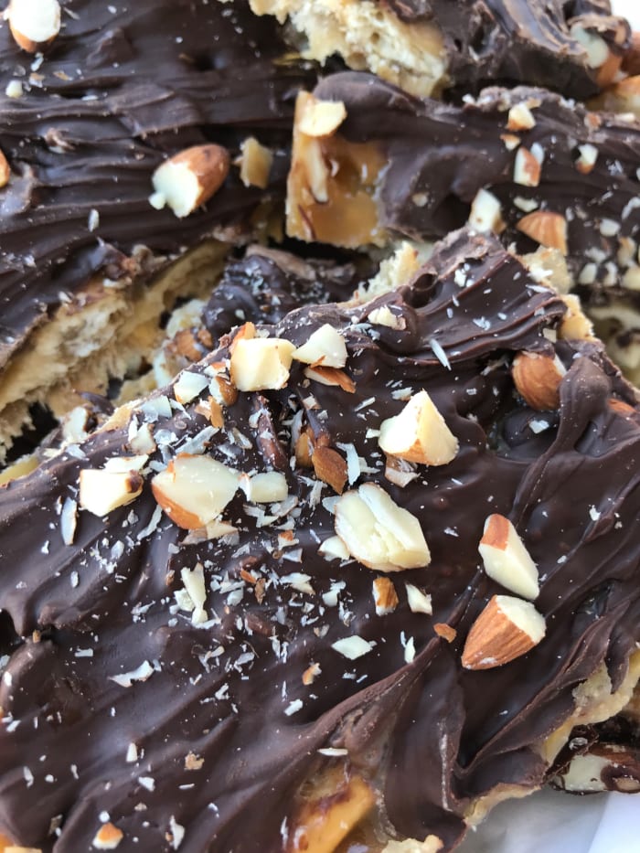 Millionaire cracker candy/saltine toffee candy with chocolate and almonds—this stuff is fantastic. Luscious buttery toffee, chocolate, and almonds are a perfect combination.