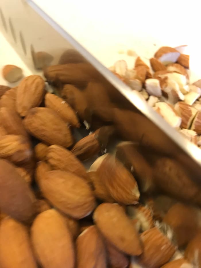 You can certainly use slivered almonds, but I buy whole almonds in bulk which are amazingly less expensive. So I take just a minute or two and chop mine.