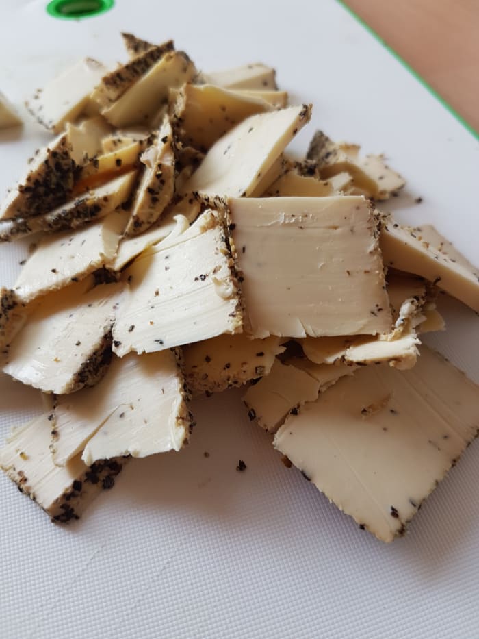Chop the pepper cheese into small bits so it is easier for it to melt into the pepper cheese sauce.