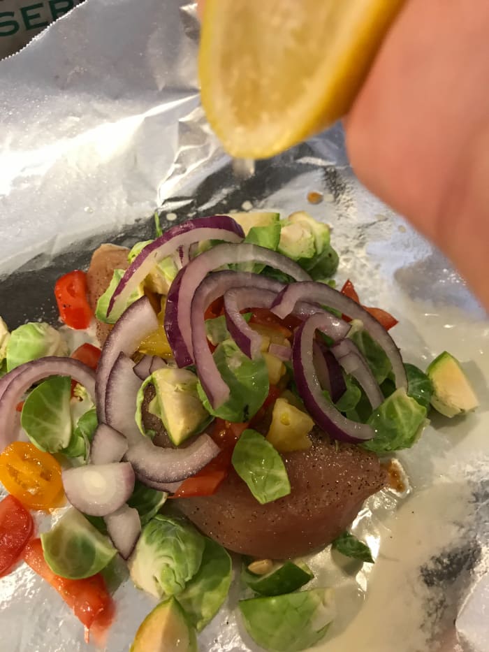 A few slices of red onion on top of the chicken and vegetables adds great flavor and pretty visual appeal.