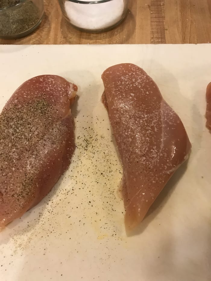 Salt and pepper are all that's needed—I use kosher salt and freshly cracked black pepper. Season both sides of the chicken.