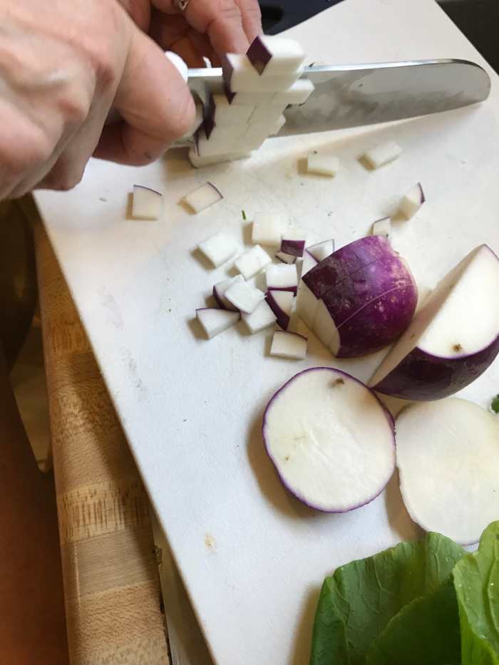 Cut the turnip into very small dice. Turnips are nice and sweet, and using some fresh turnip as well as the root is beautiful. The sweet turnip is a nice balance against the slight bitterness of the greens.
