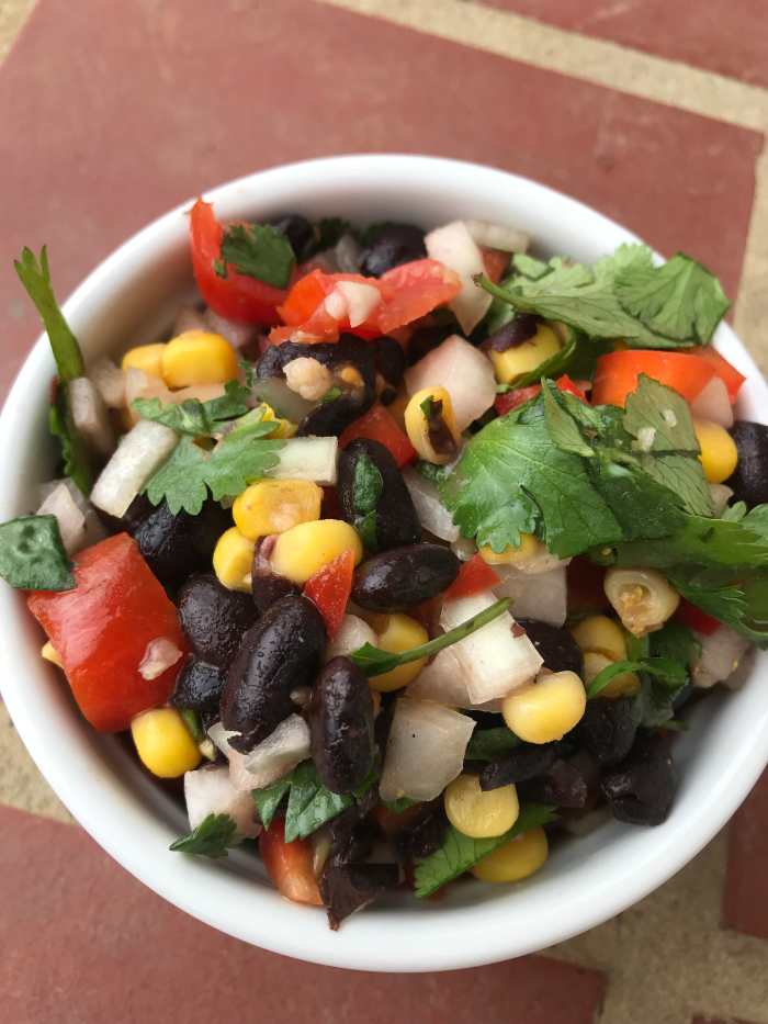 This stuff is amazing. I'm always looking for ways to get more fresh veggies into my kids, and I adore recipes that they love as much as I love the nutrition. This fresh black bean salsa is the perfect way to do that.