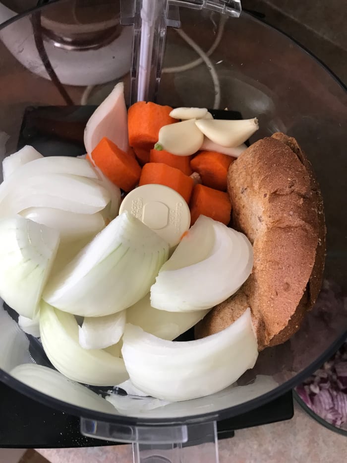 Keep additives simple, too. Use one large onion, one large carrot, fresh whole garlic, and whole grain bread. Use the heels of the bread if you wish for a budget-boosting tip. This bread is hearty enough to hold its own, binding the meatloaf.