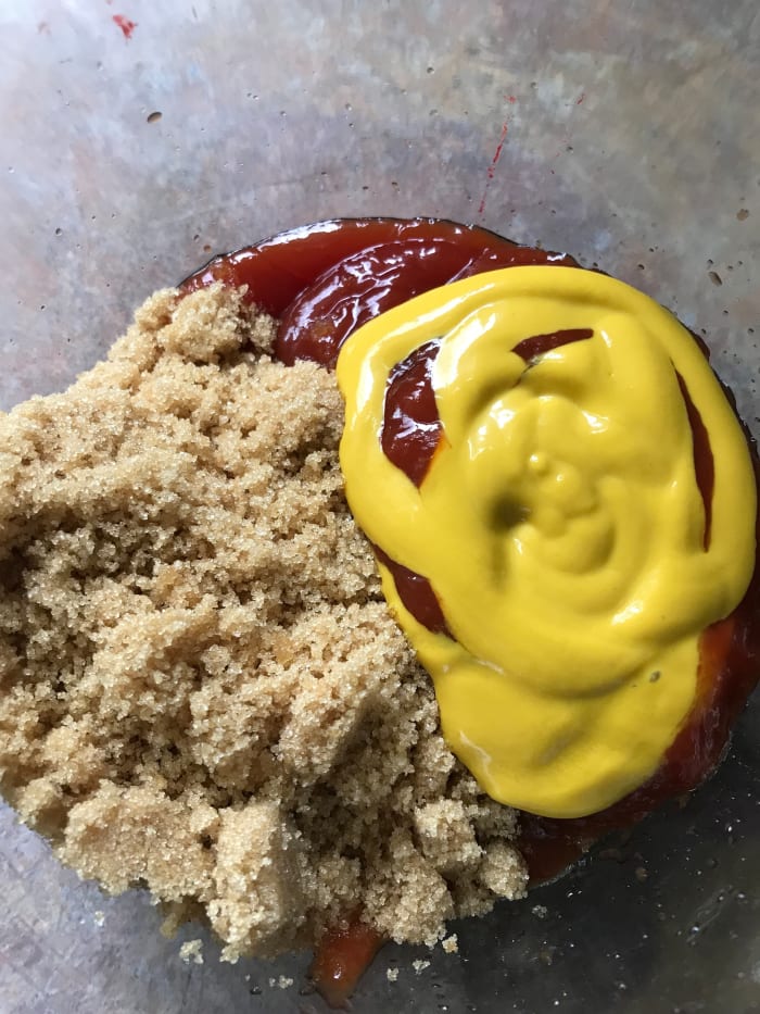 Make a simple and delicious glaze for your meatloaf by mixing together equal parts ketchup, yellow mustard and brown sugar, and pouring over the meatloaves prior to baking. Bake for about 1 1/4 hours at 350F or until 160F internal temperature.
