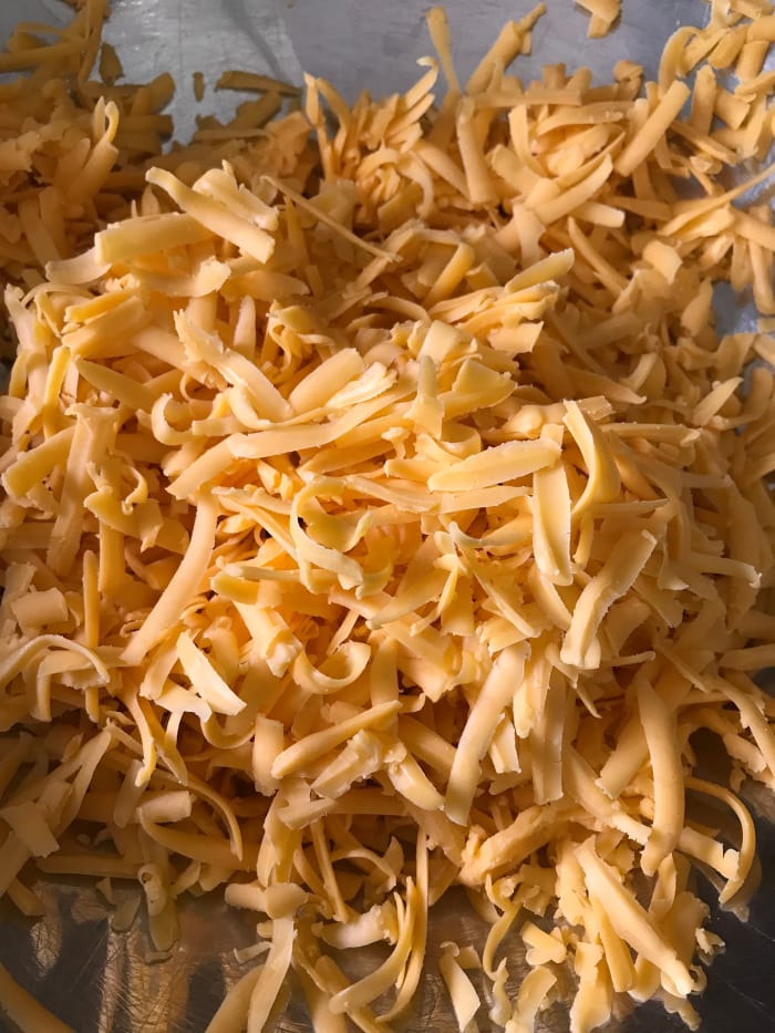 Extra sharp cheddar cheese is the go-to for this recipe. The strong flavor balances perfectly against the beef and vegetables in this dish. Grate it yourself to save money, or grab the package of already grated cheese to save time!