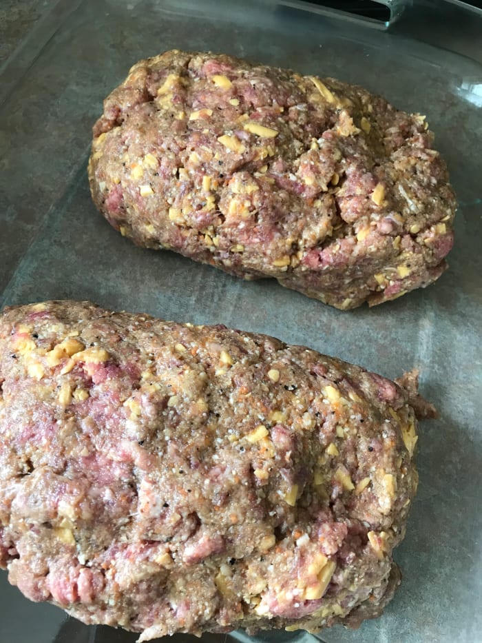 Place the shaped meatloaves onto a rimmed baking sheet or into a 9x13 baking dish. If desired, freeze any number of meatloaves at this stage by wrapping tightly in plastic wrap.