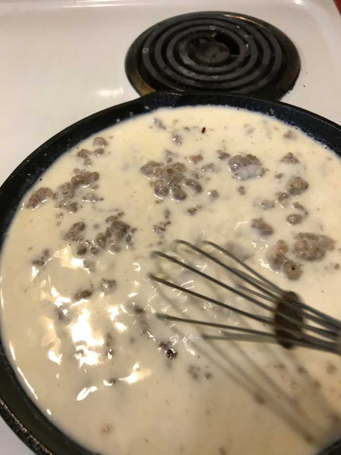 Watch the sausage gravy as it gets to the boiling point. You need to let it simmer for at least a minute to cook off the raw flour taste and to get it to thicken correctly, but boiling can 'break' it, leading to a greasy gravy.