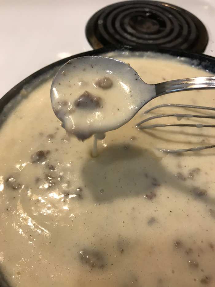 When it has simmered for at least a minute and has thickened. See how it coats the spoon in this picture? That's just right. It will also continue to thicken as it sits, so if you like it thicker, just wait a minute. If you can ;-)