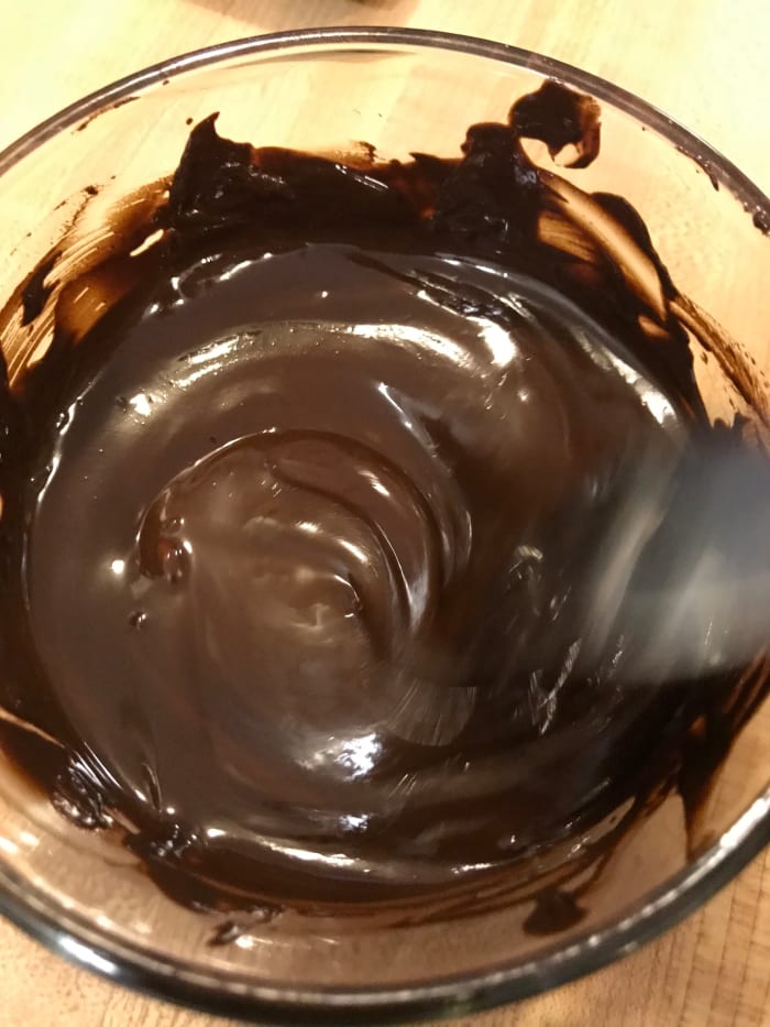 Melting the unsweetened chocolate and creaming it into the butter and sugar is one trick to success for this easy chocolate fudge cake.