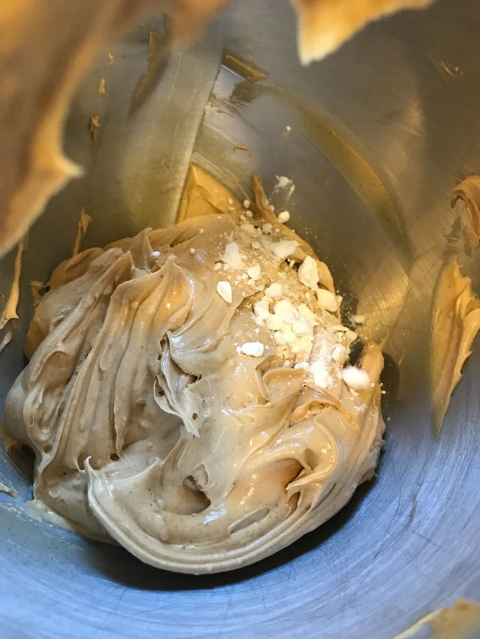 Add the powdered sugar a little at a time, beating well in between. This just keeps it from flying all over the kitchen. You're looking for the consistency of a nice, stiff cookie dough. It needs to be scoopable.