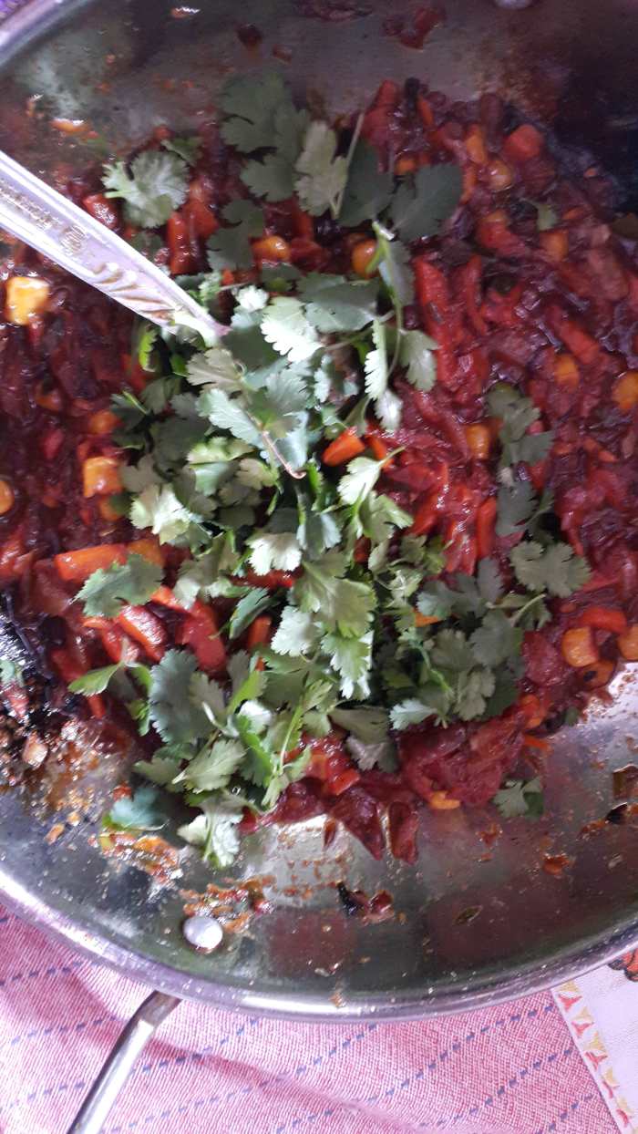 Lemon juice added (from lemon) and the mixture is garnished with cilantro/coriander leaves. Your thick vegetable sauce is ready now.