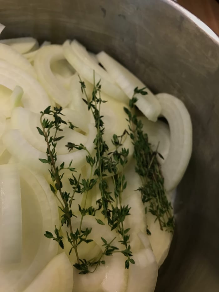 Not strictly necessary, fresh thyme brings a beautiful, citrusy, woodsy note to the party. Throw it in whole - the leaves will fall off as the onions cook, and just pull out the stems later.
