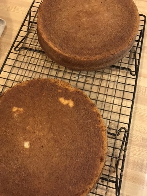 Cool the cakes in their pans for about ten minutes - this lets the cakes rest. Then invert them onto a wire rack and allow them to cool completely.
