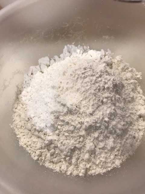 Stirring together the dry ingredients in a separate bowl helps make sure there's an even distribution of them in the finished cookie dough, without overworking the gluten, which could make the cookies tough.