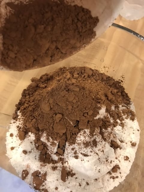 Add the cocoa powder to the other dry ingredients, then stir in 1 teaspoon salt and 1 tablespoon of baking soda. You can use plain cocoa powder, don't worry about getting the more expensive Dutch-processed variety.