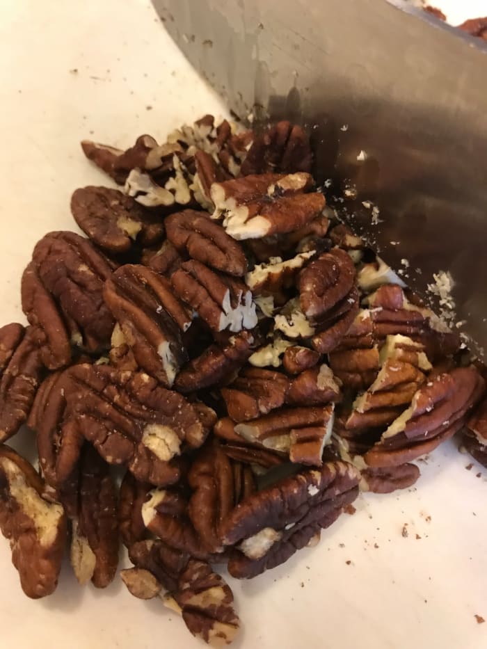 I buy pecans in bulk, so I almost always have whole pecans. If you buy them at the grocery store, you can probably get pecan pieces for less, saving a bit of money.