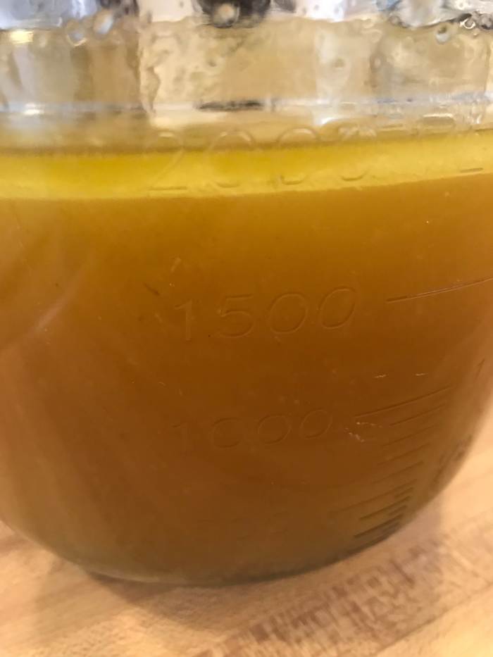 You'll notice that the fat will rise to the top - that's fine. Stick the broth into the fridge and let it chill completely. This will make removing the fat super easy.