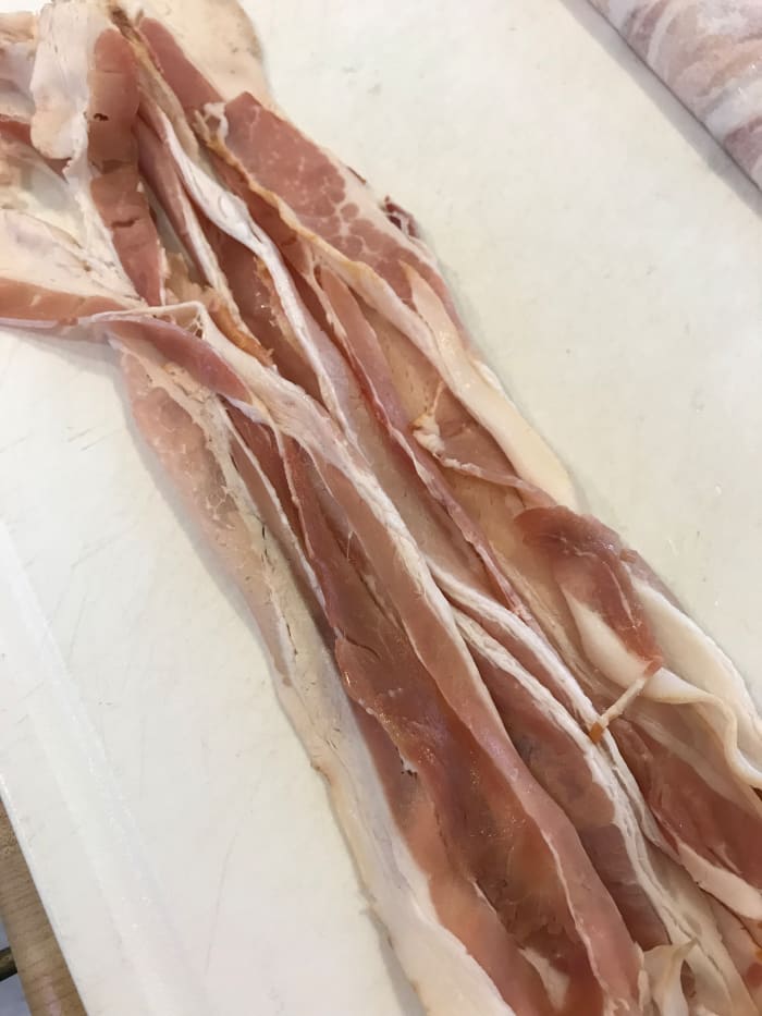 Start with the bacon! I find the easiest way to deal with bacon is to dice it small while it's still raw. This is easiest to do if the bacon is really cold—stick it in the freezer for just a few minutes before cutting it into small pieces.