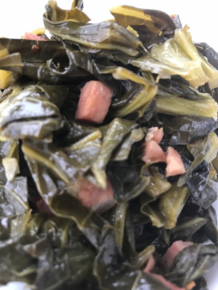 Rich and delicious, southern style collard greens are loaded with nutrients and fiber. Serve with creamy grits or cast iron skillet cornbread for a perfect meal.