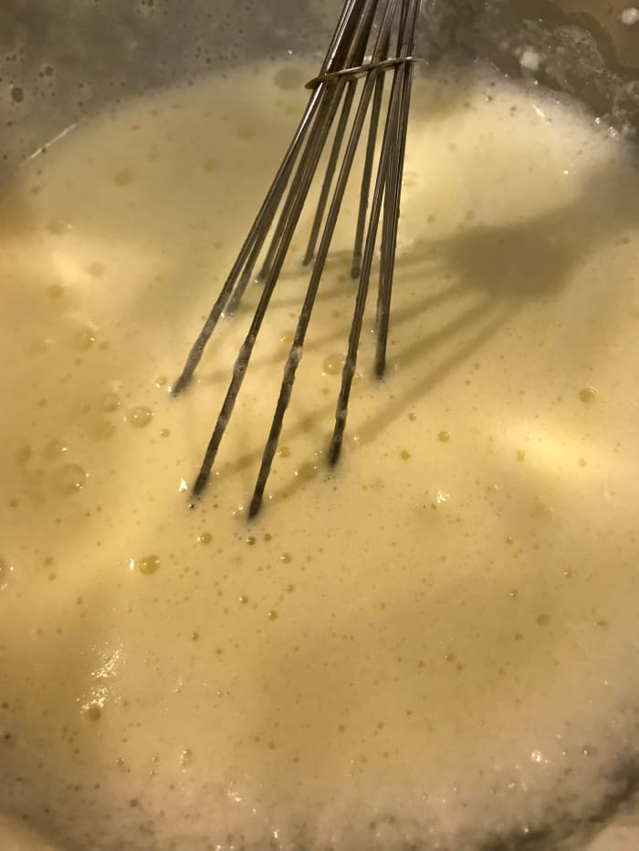 Once the custard base has completely chilled, whisk together the whites and milk/cream mixture. You can store it in the fridge at this point, simply whisk it well again before serving.