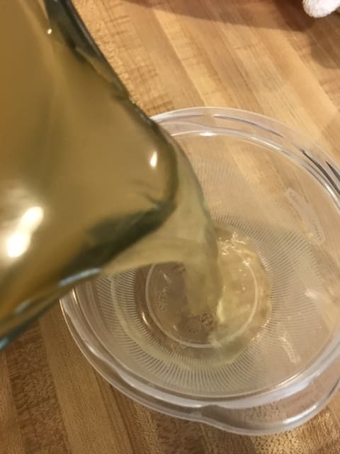 Pour off a cup of the broth and set it aside before adding the remainder to the pot. You'll be using that reserved broth to make a slurry in order to thicken the soup later. Keep it cold or at room temperature.
