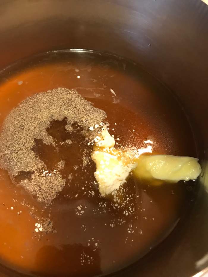 In a medium saucepan, bring the broth, butter and seasonings to a simmer. Keep it warm while you toast the orzo. This will help with the lovely texture of the finished rice pilaf, helping ensure it stays nice and fluffy.
