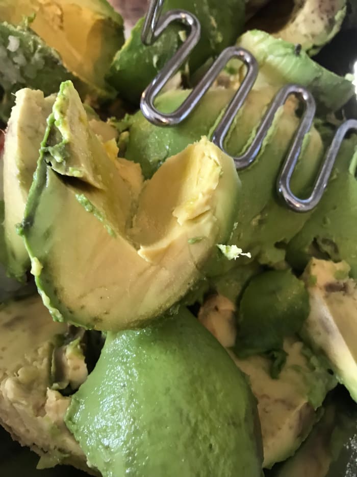 I like guacamole a little (not a lot) chunky. I use a potato masher to get the texture just right. If you want bigger chunks then mash less, or keep going for a super creamy consistency.