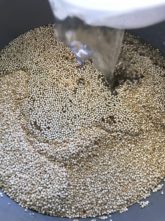 Quinoa can be cooked with just plain water, and I do that all the time. But feel free to up the flavor with any kind of stock you wish. Beef, chicken or vegetable stocks all work great, as does adding just a splash of wine or really good vinegar.