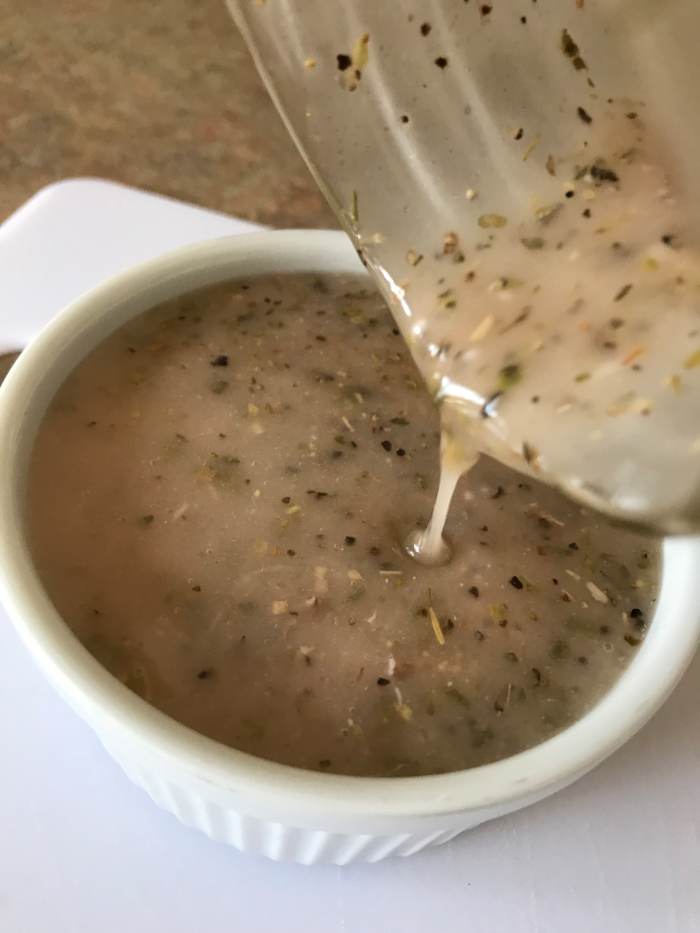 You can stash the dressing in the fridge for up to several days if you want to make it ahead - just give it a good hard shake again before serving. The olive oil could solidify in the fridge, but it will liquefy as it comes to room temperature.