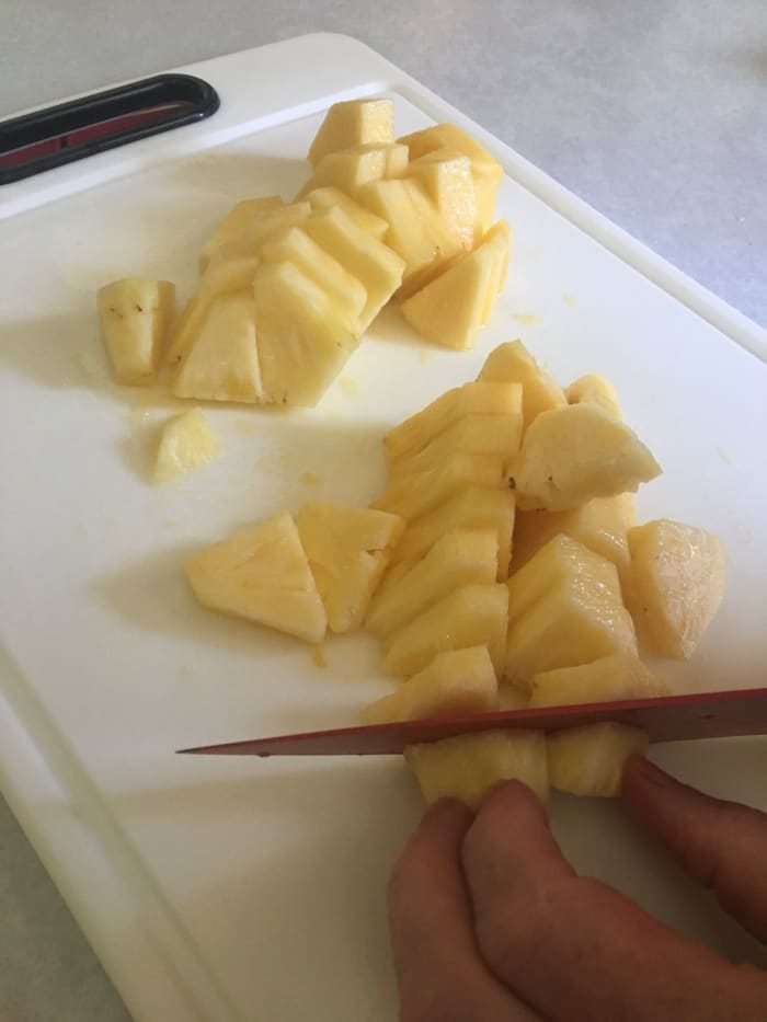 While canned pineapple tidbits would probably work in this recipe, there's nothing like freshly cut pineapple.