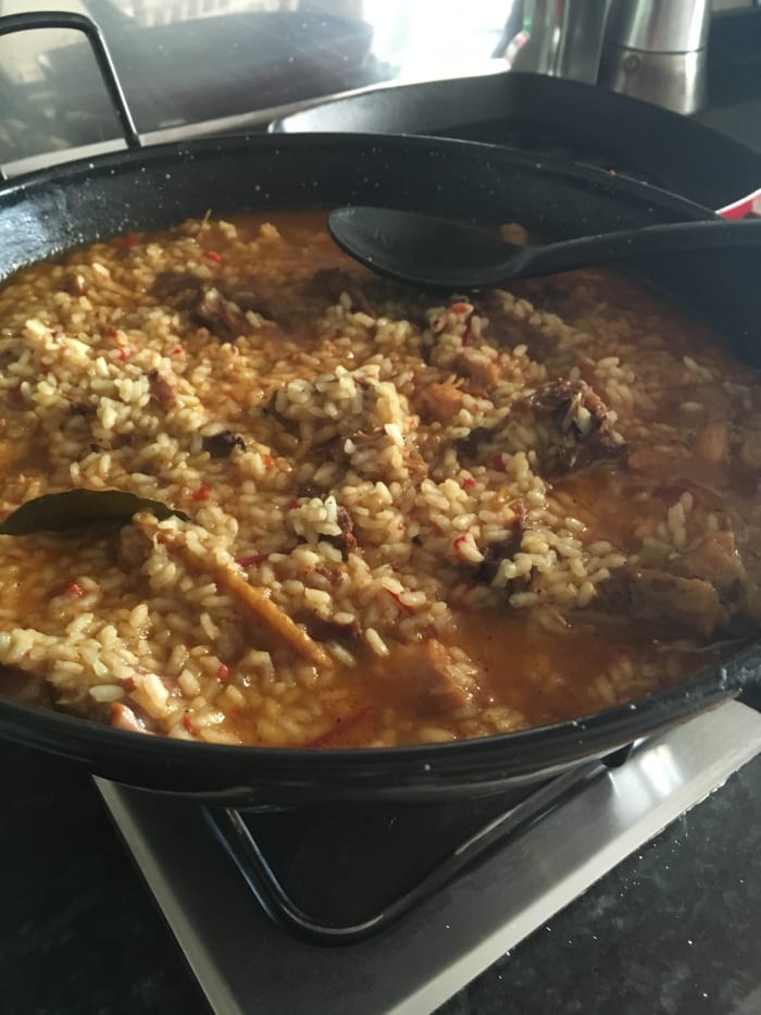 This authentic arroz con pollo recipe from Extremadura was made without colorants. It has a lovely thick broth that pools around the cooked rice.