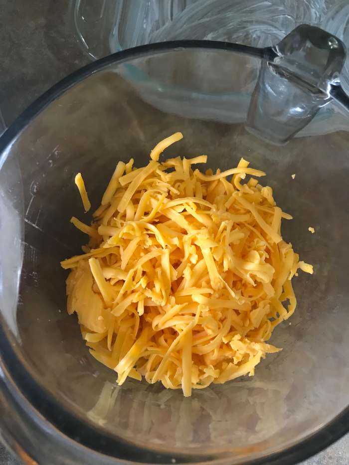 You can use whatever type of cheddar you like. I personally like the extra sharp cheddar for this dish. It's a great contrast against the sweetness of the sauce and the zing of the pineapple.
