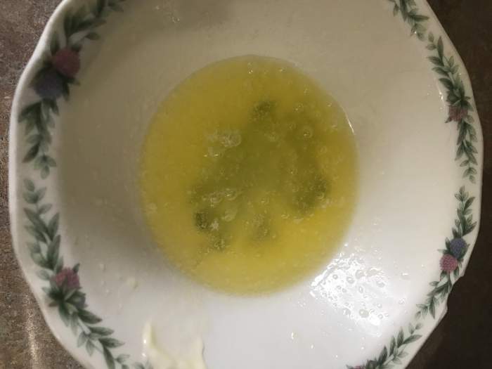 Zap the butter in the microwave for just a few seconds to melt it completely. This makes tossing with the cracker crumbs much easier.