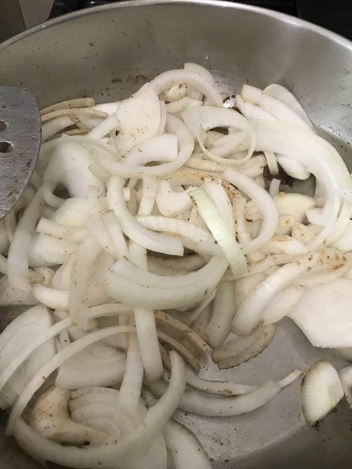 You don't have to use onions - I don't think I did in the video below. But they add a great flavor to the gravy. Start by cooking the onions in the same skillet as the steaks until they soften and become fragrant, about ten minutes.