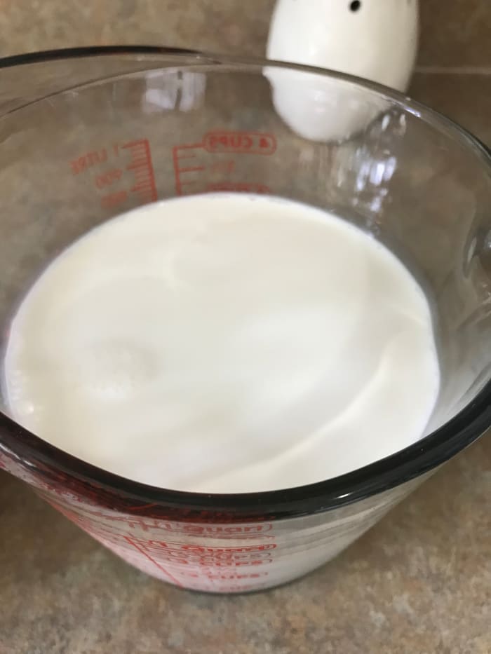 Three cups of half and half serve as the base for building the ice cream custard. Combine the half and half with milk and cocoa and simmer to perfection.