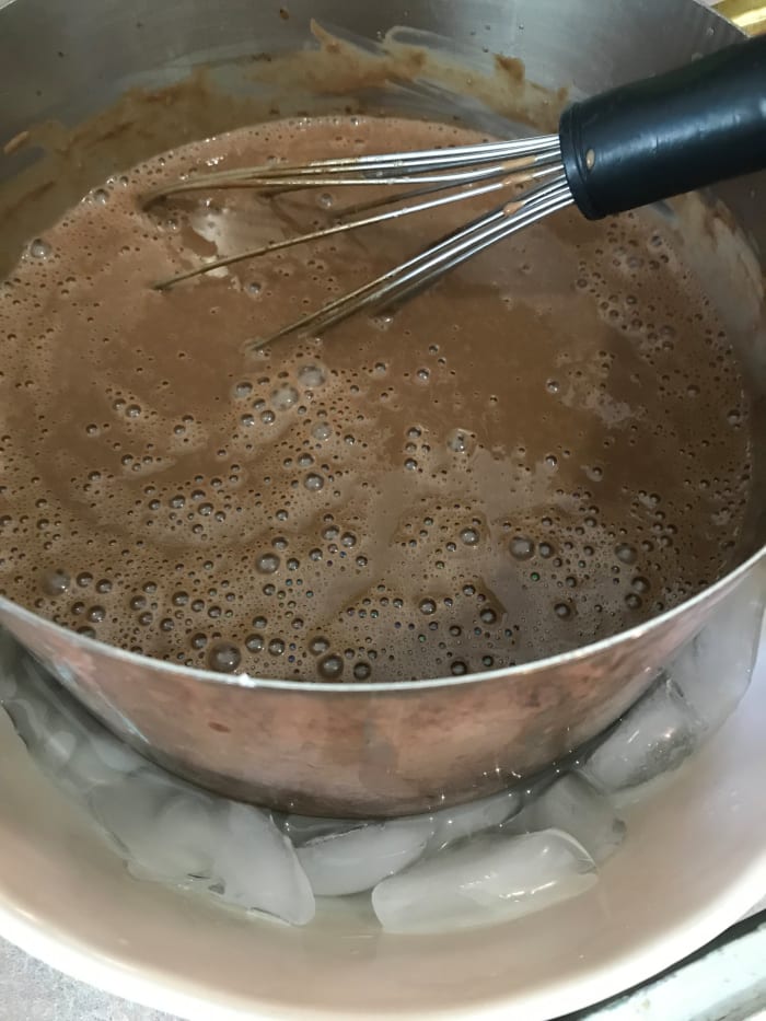 You can stash the mixture in the fridge for a few hours, or you can set the pan in a bowl of ice cubes. Whisk occasionally and the mixture will come down in temp within half an hour.