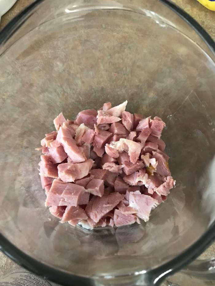 Two cups of diced ham is all it takes, although you can add up to four cups if you wish. I like dicing it nice and fine, but you can leave it chunkier if you wish.