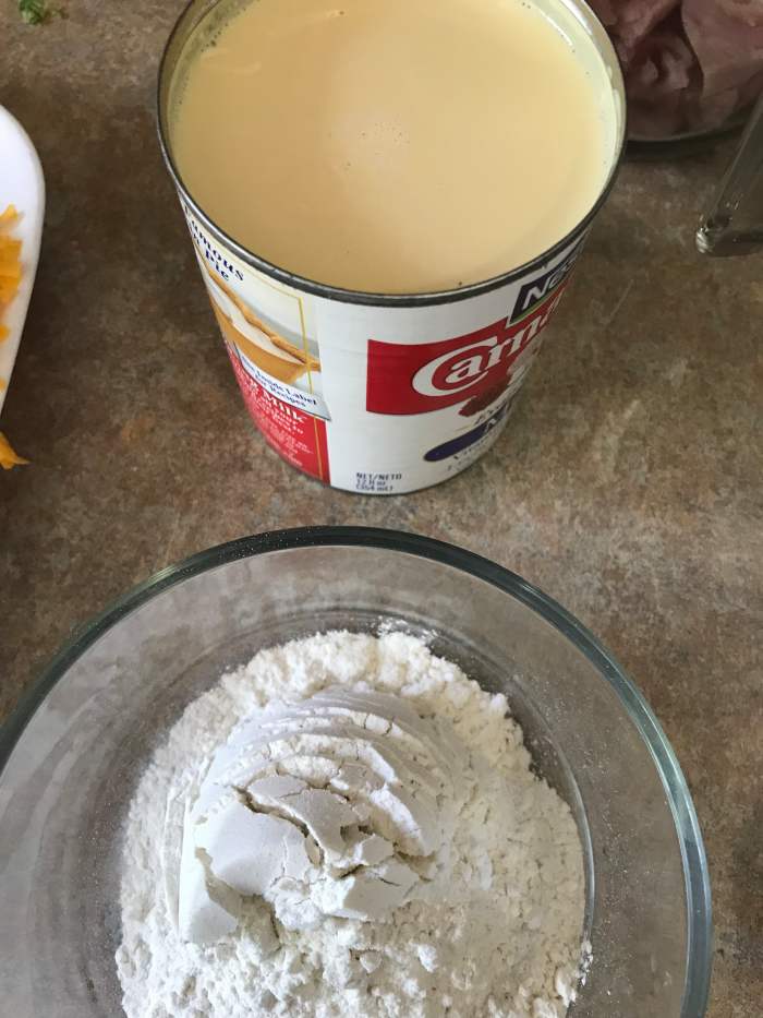 Evaporated milk and a quarter cup of all-purpose flour are all it takes to finish the bechamel. Strictly speaking, you can use another cup and a half of whole milk instead of the evaporated milk, but the evaporated milk makes the sauce nice and rich.