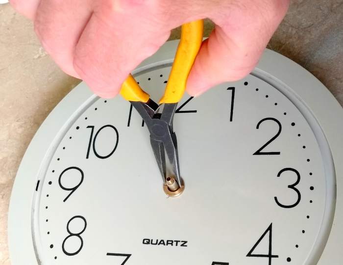 Attach the retaining ring for the clock movement. Don't excessively tighten it as it can deform the insides of the movement.