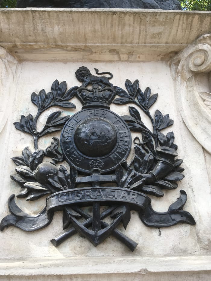 Emblems of the Royal Marines - The Globe and Laurel - also the bomb and horn of the artillery and light infantry which were abolished in 1923.