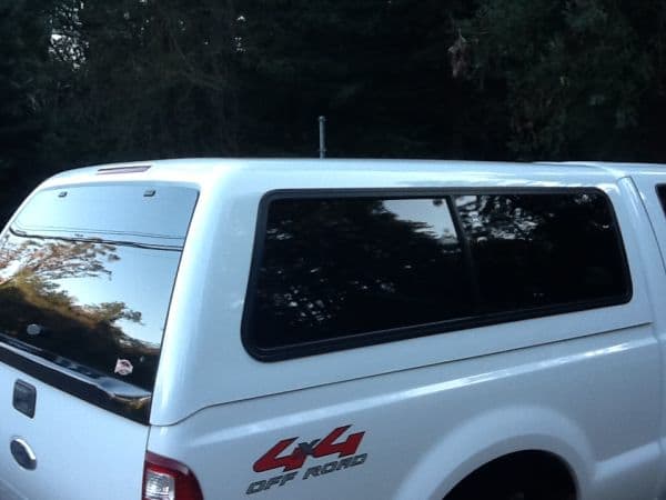 A 2008 Superduty. Notice the molded piece on the back door of the shell that covers up the step that comes out of the tailgate on this truck.