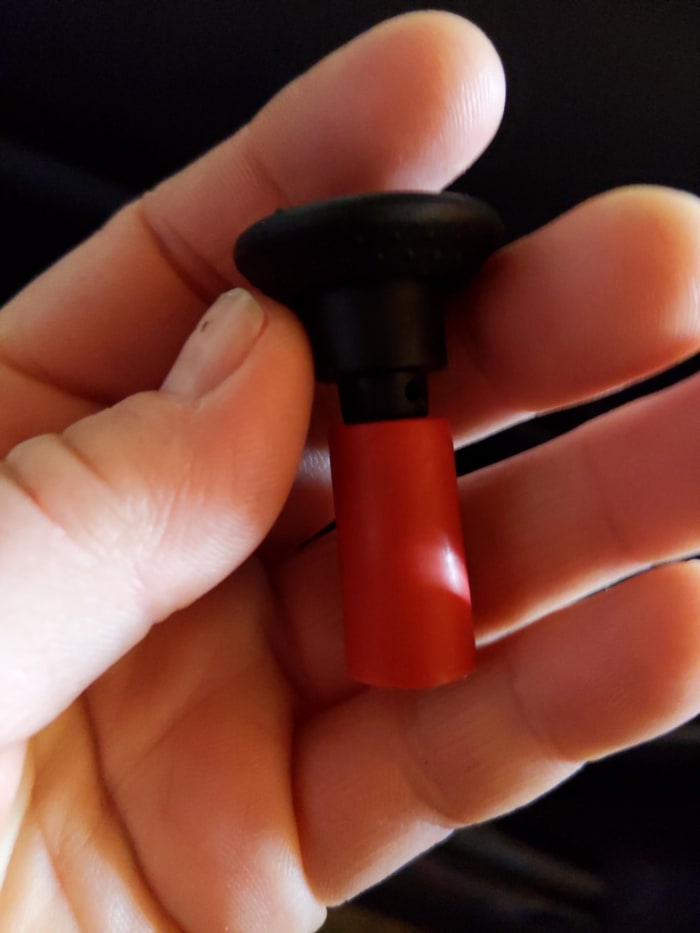 This is the latch knob from the rear seat of a 2006 Subaru Baja. It has snapped off and leaves no access to storage area behind rear seat.
