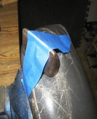 This 2 lb. dolly provided just the right amount of pressure and shape. The masking tape simply keeps it from falling off. Don't use duct tape, which could peel off the top coat!