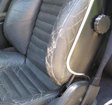 This seat is in a classic car that is still all original, although it shows obvious signs of wear and patina. The owner wants to keep it original rather than restoring it.